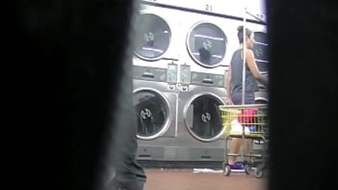 I slutty exhibitionist flashes her upskirt for a voyeur's delight at the laundry, Part 2