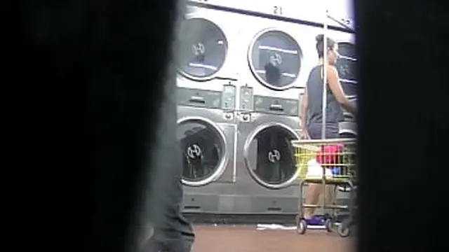 I slutty exhibitionist flashes her upskirt for a voyeur′s delight at the laundry &mdash;  Part 2